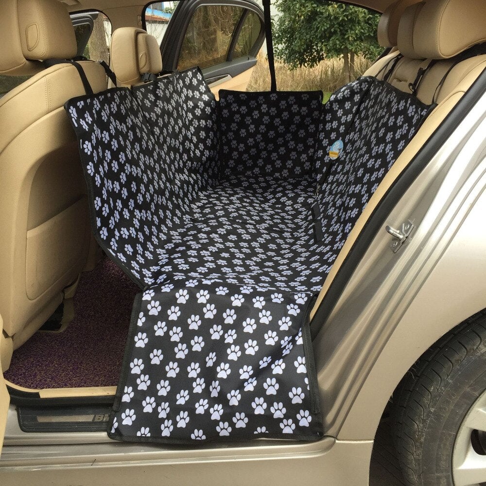 Car seat cover with paw pattern installed in a vehicle