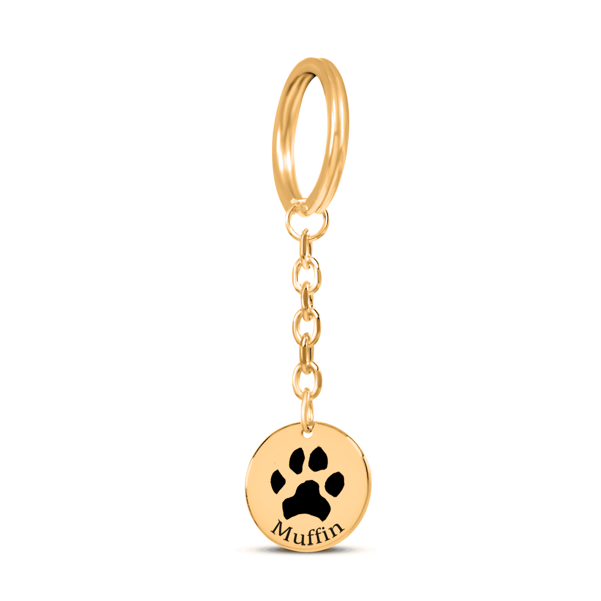 Gold keychain with paw print and 'Muffin' engraving on a white background