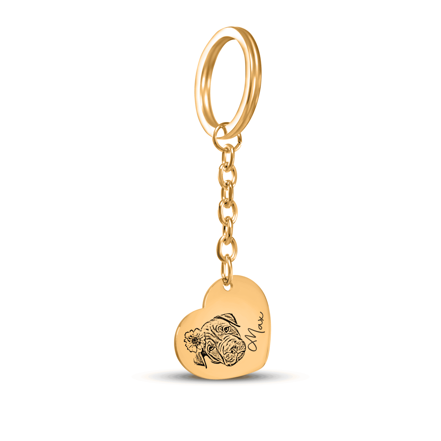 Gold heart-shaped keychain with engraved design on a white background