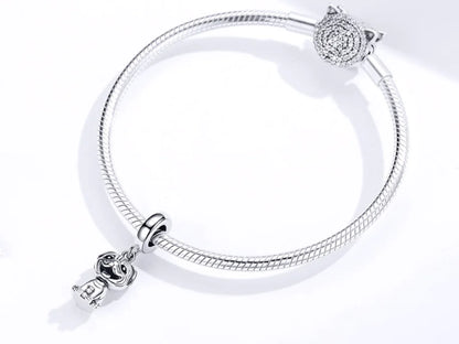 Silver bracelet with charms on a white background